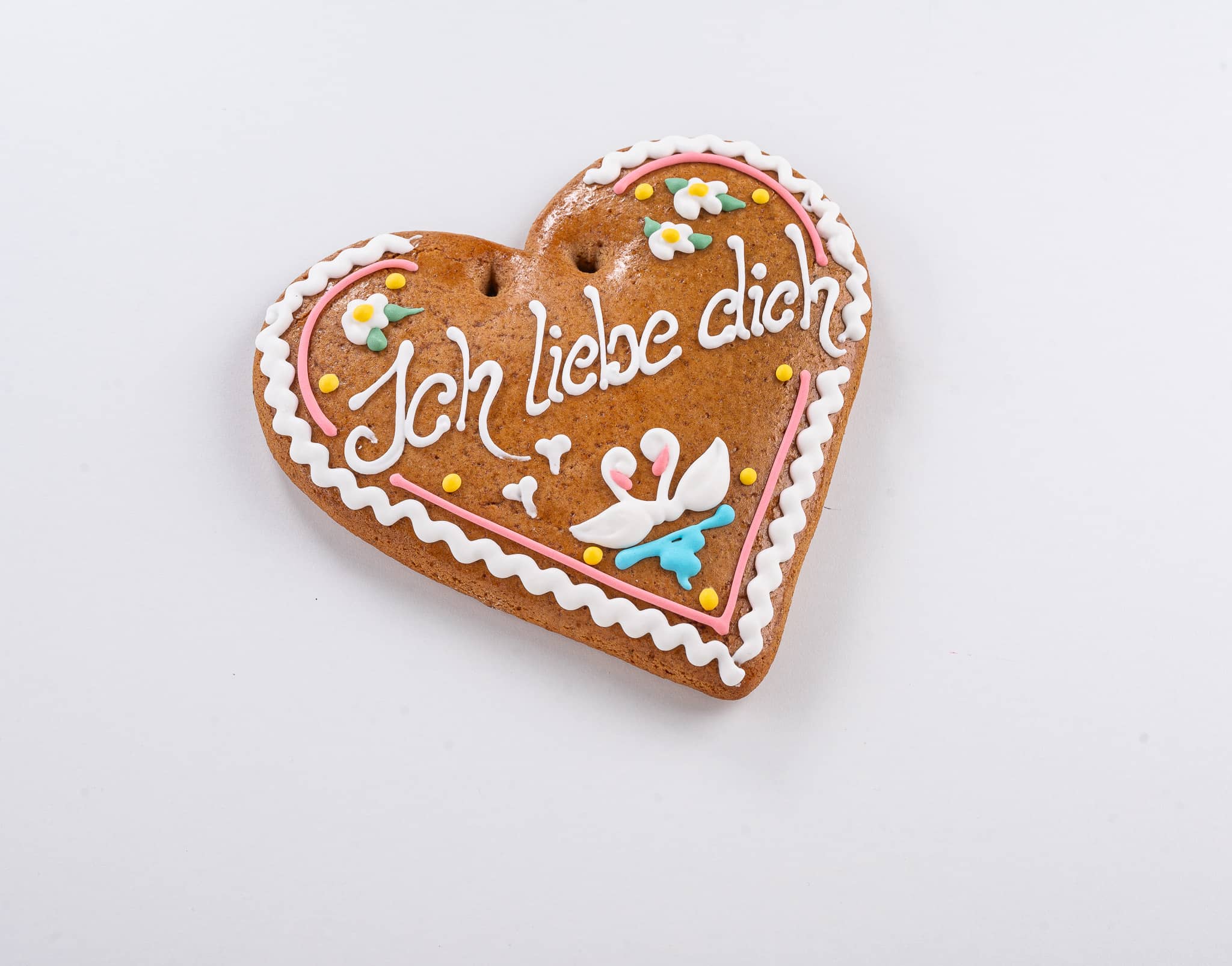Lebkuchenherz verziert mit Zuckerguss und Aufschrift ich liebe dich